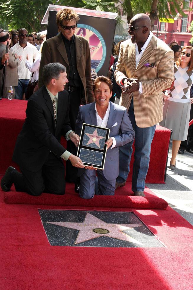 Leron Gubler, Barry Manilow, Chris Gardner and Dave Koz at the Hollywood Walk of Fame Star Ceremony honoring Dave Koz Capital Building in Hollywood Los Angeles, CA September 22, 2009 photo