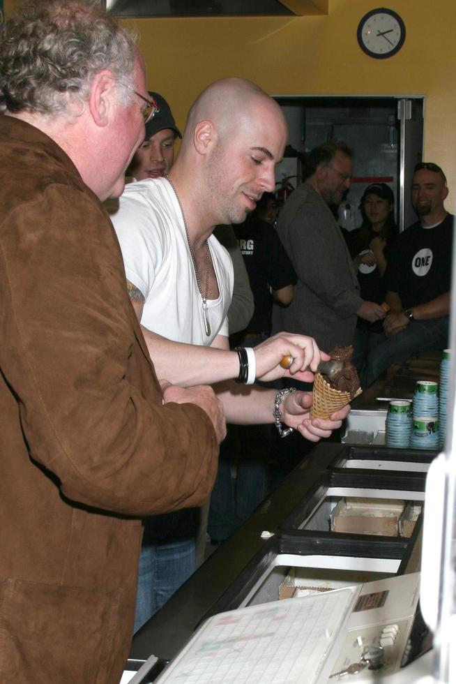 Ben Cohen of Ben and Jerry s, and Chris Daughtry Ben s showing Chris how to scoop Ice Cream Ben and Jerry s Press Conference Supporting ONE Burbank, CA April 7, 2008 photo