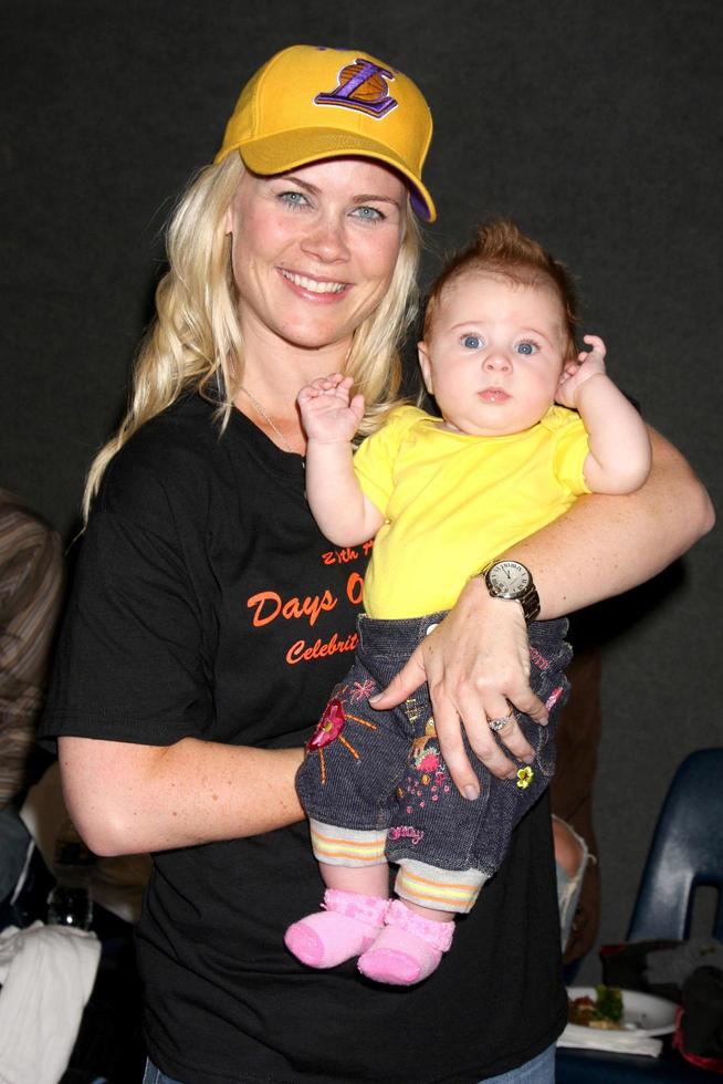 Alison Sweeney and her baby Megan Hope Sanov at the 20th James Reynolds Days of Our Lives Basketball Game at South Pasadena High School in Pasadena, CA on May 29, 2009 photo