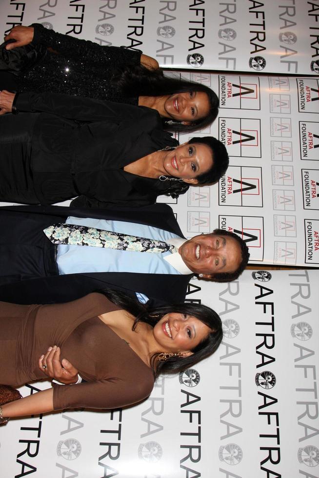 Smokey Robinson, wife Frances Glandney,and daughters Tamla and Berry arriving at the AFTRA Media and Entertainment Excellence Awards AMEES at the Biltmore Hotel in Los Angeles,CA on March, 9 2009 photo