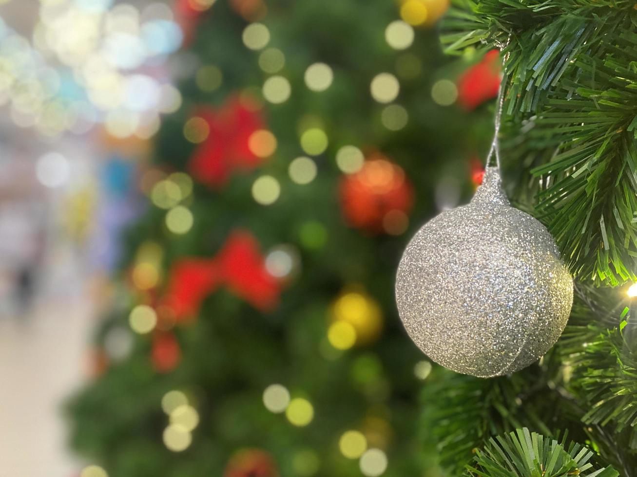 Christmas ball on tree background. Happy New year and Merry Christmas 2023 celebration concept photo