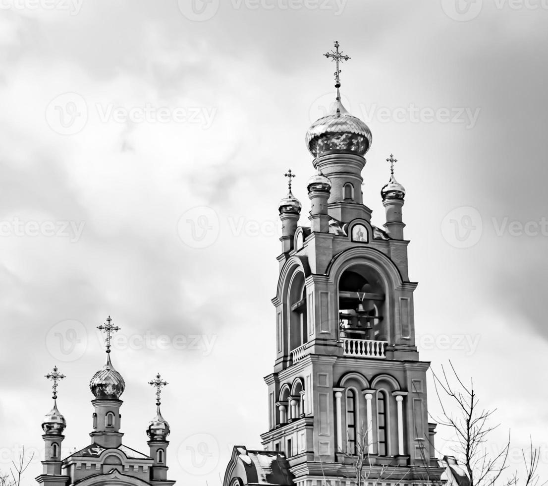 Christian church cross in high steeple tower for prayer photo