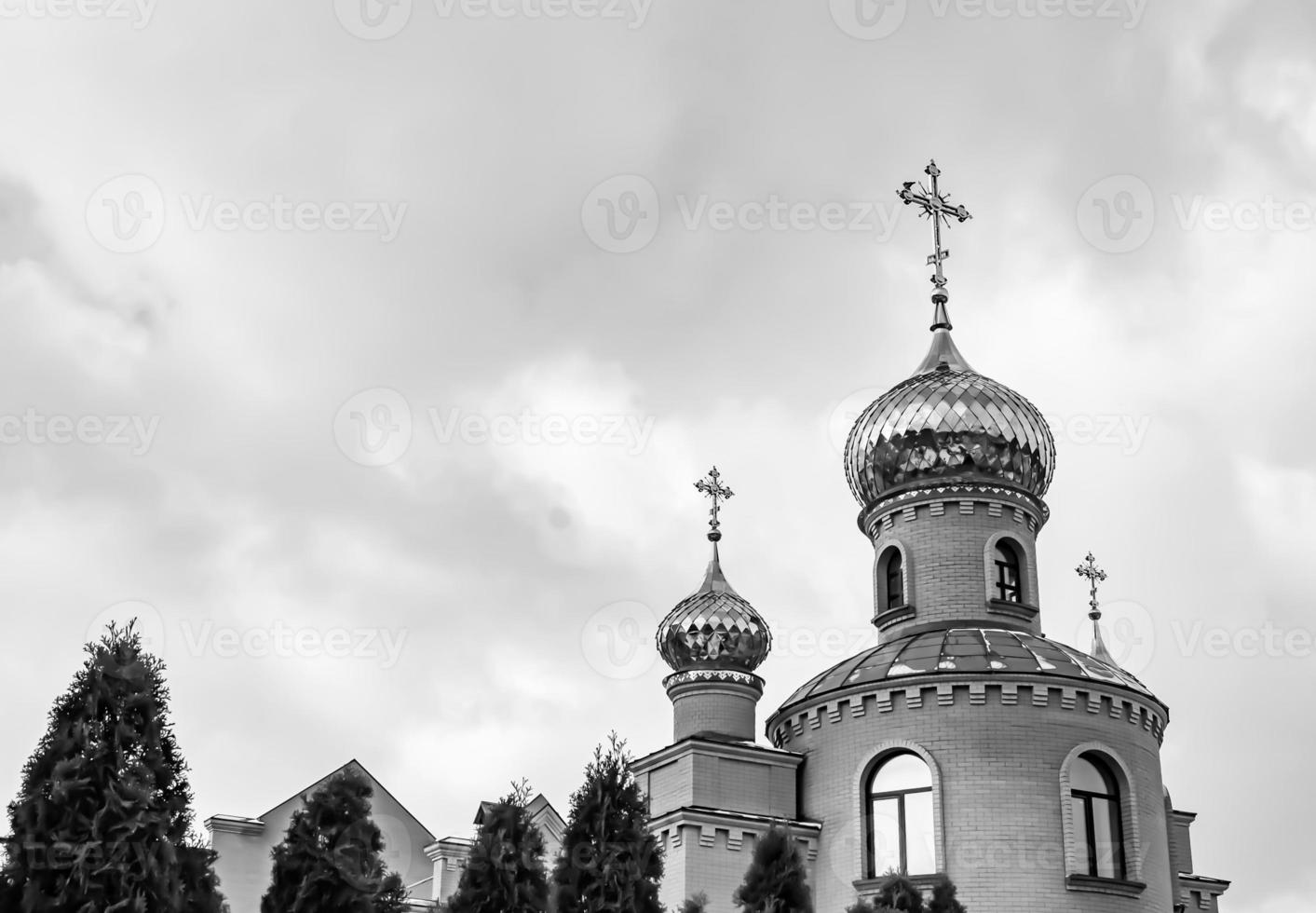 Christian church cross in high steeple tower for prayer photo