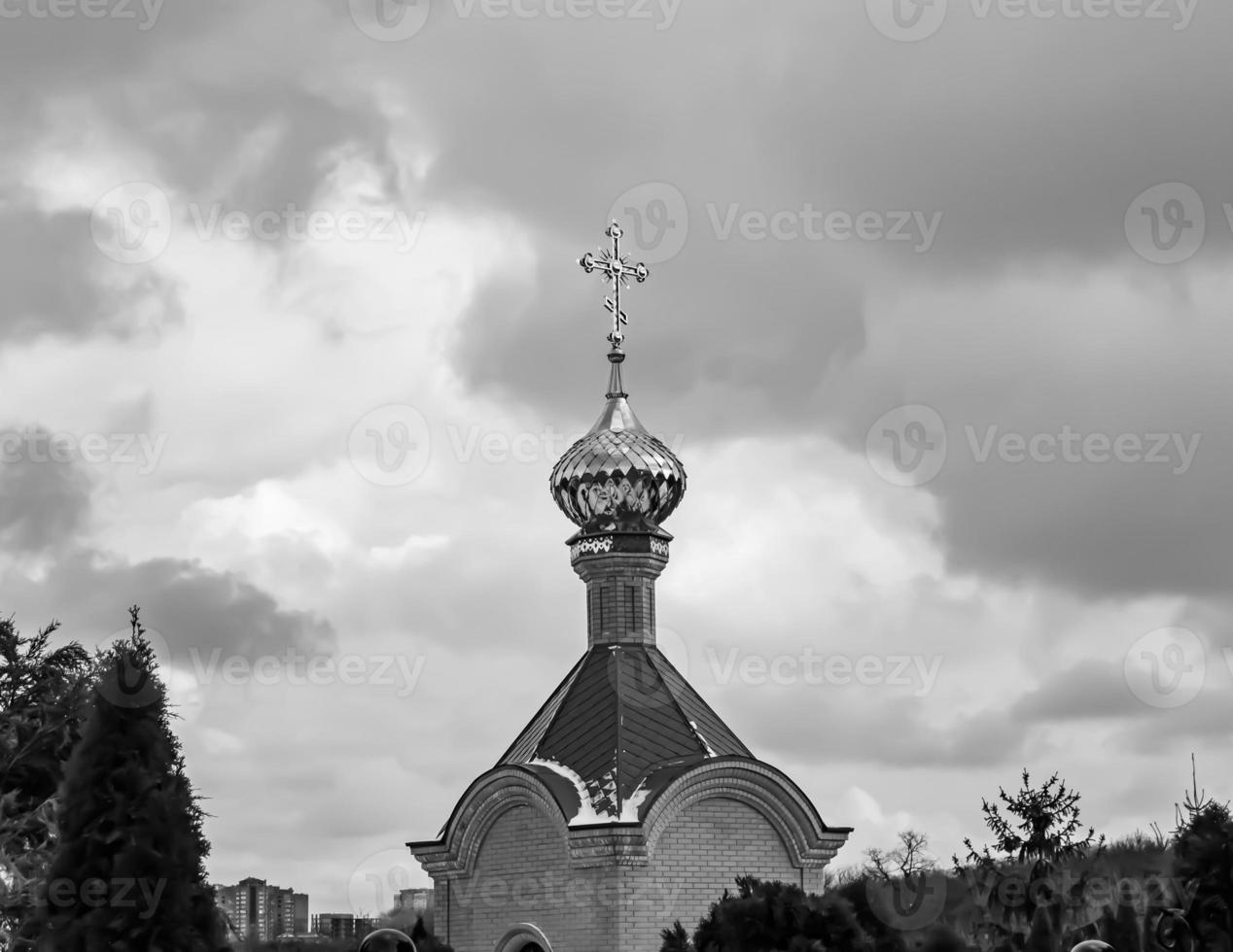Christian church cross in high steeple tower for prayer photo