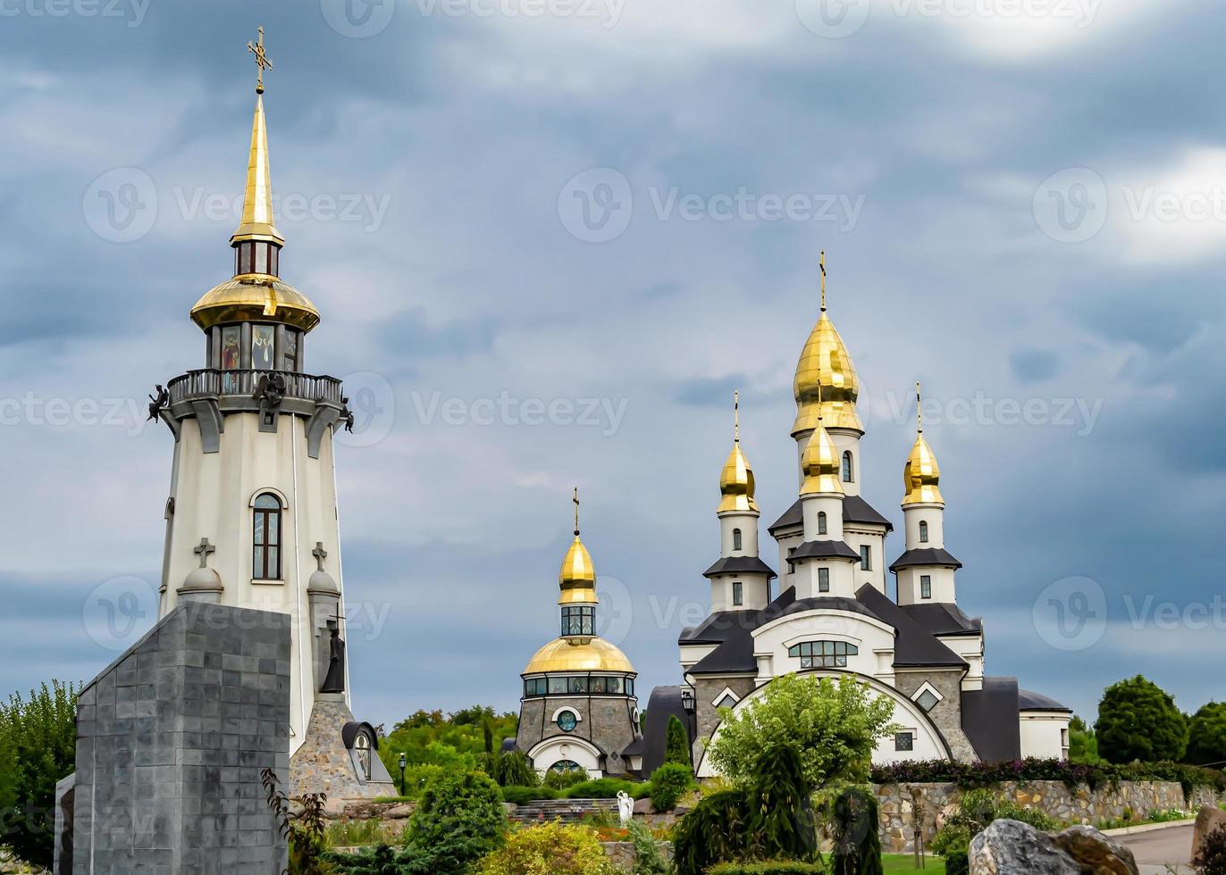 Christian church cross in high steeple tower for prayer photo