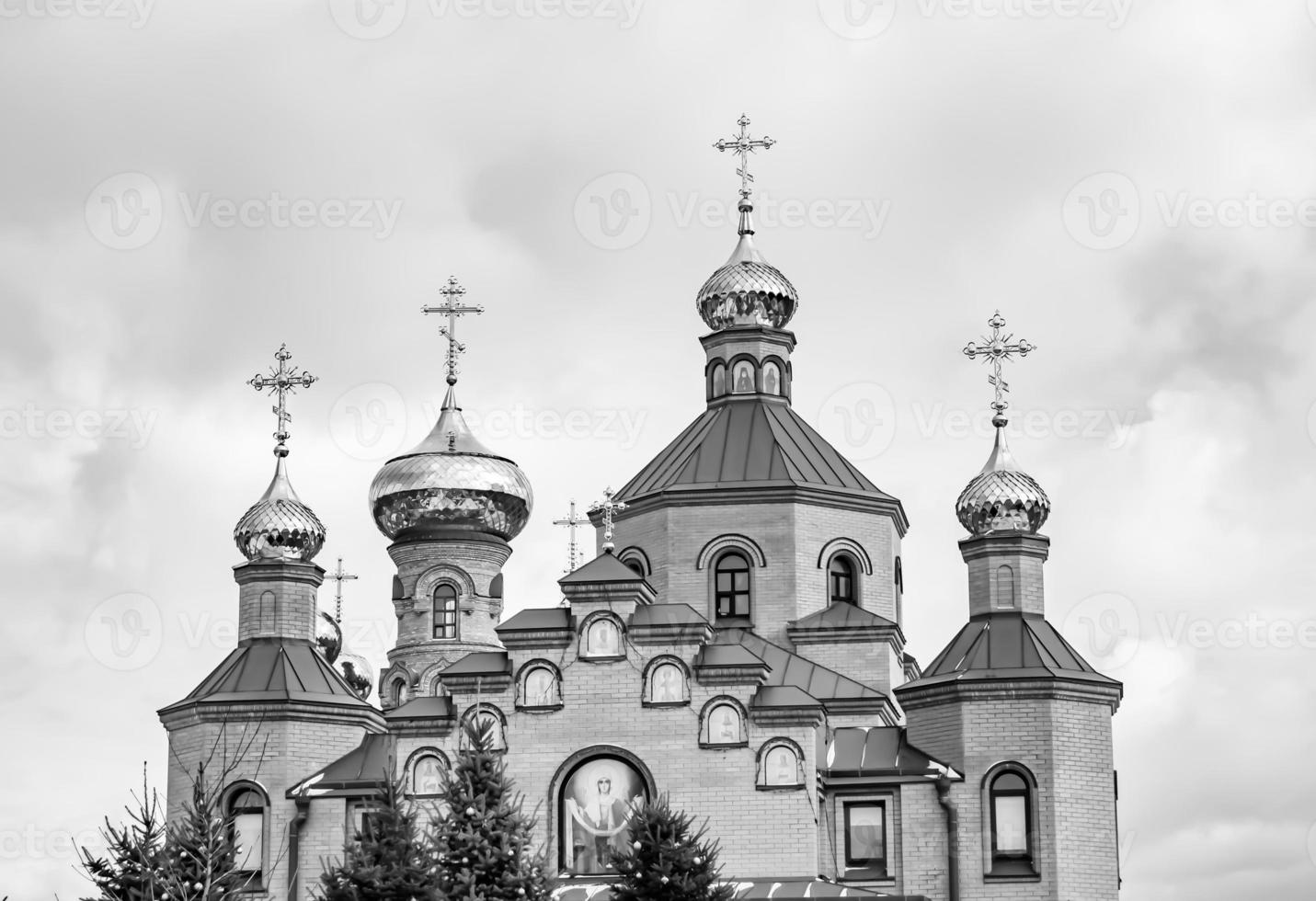 Christian church cross in high steeple tower for prayer photo