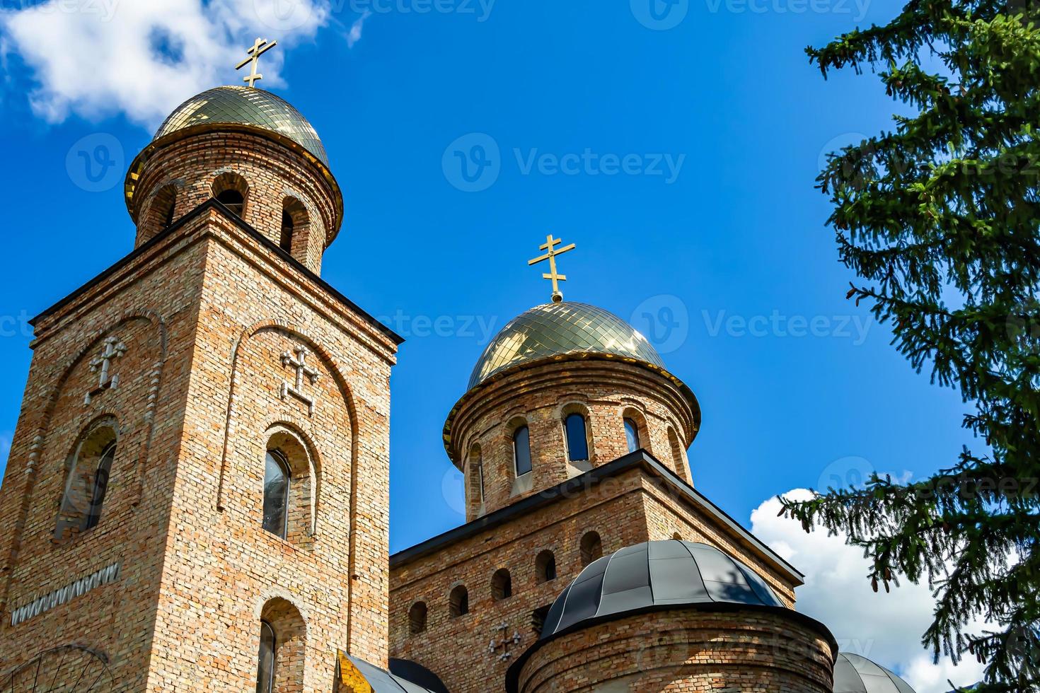 Christian church cross in high steeple tower for prayer photo