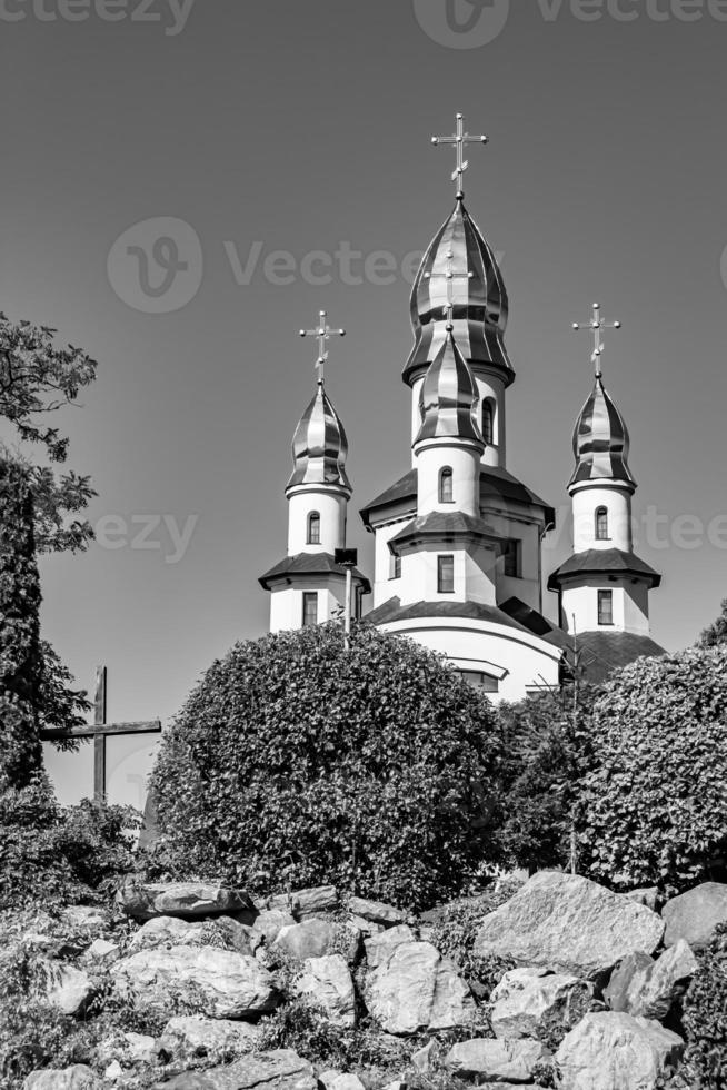 Christian church cross in high steeple tower for prayer photo