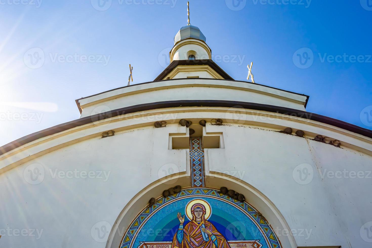 Christian church cross in high steeple tower for prayer photo