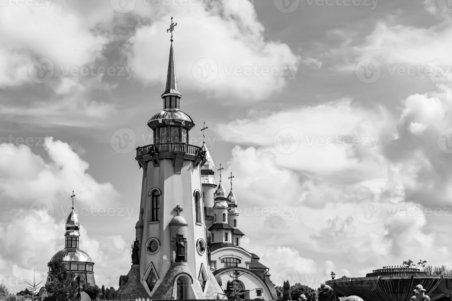 Christian church cross in high steeple tower for prayer photo