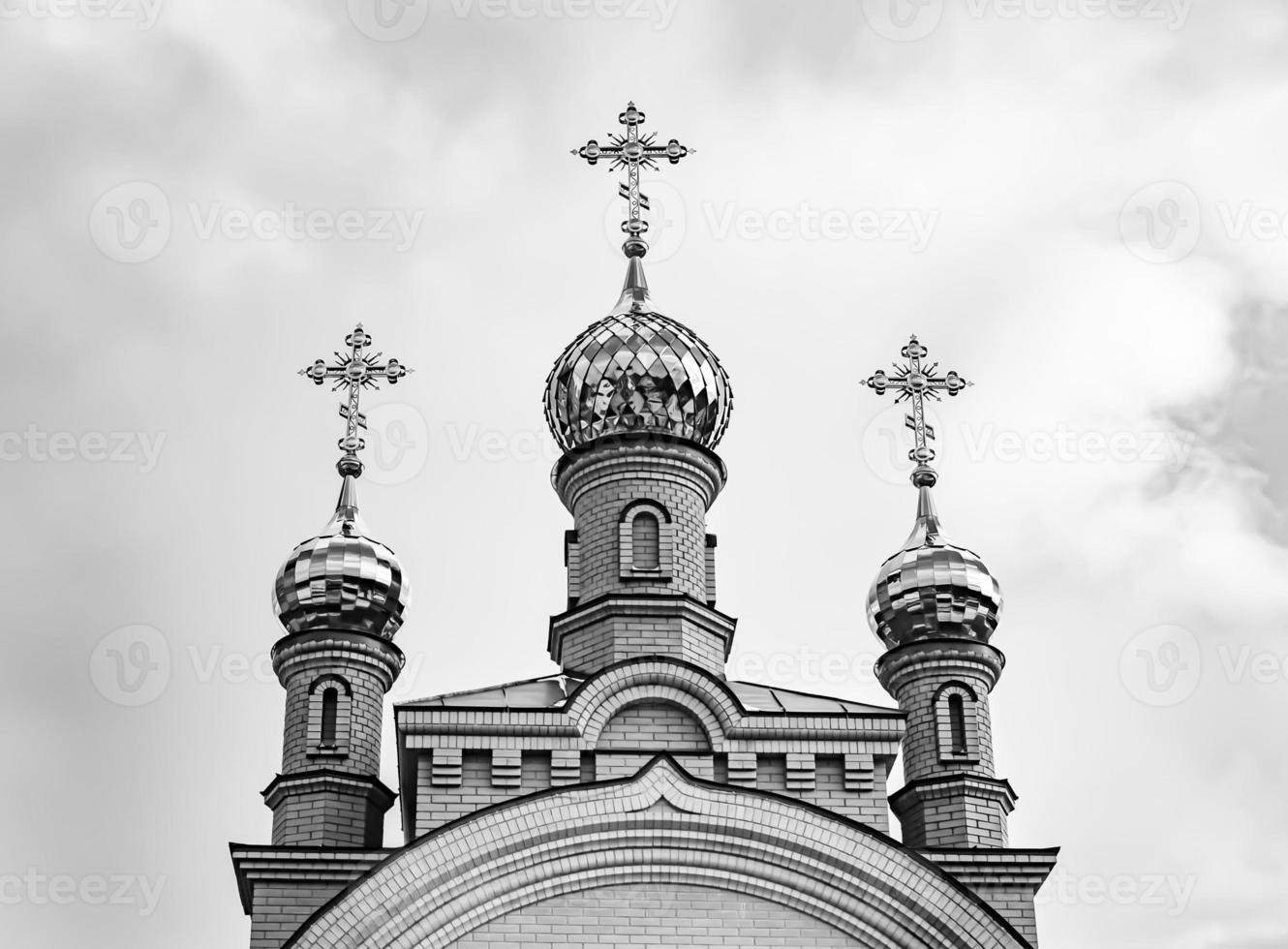 Christian church cross in high steeple tower for prayer photo