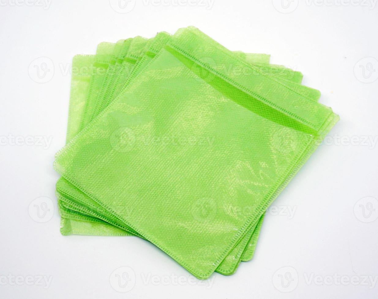 green plastic disck cover isolated on white background photo