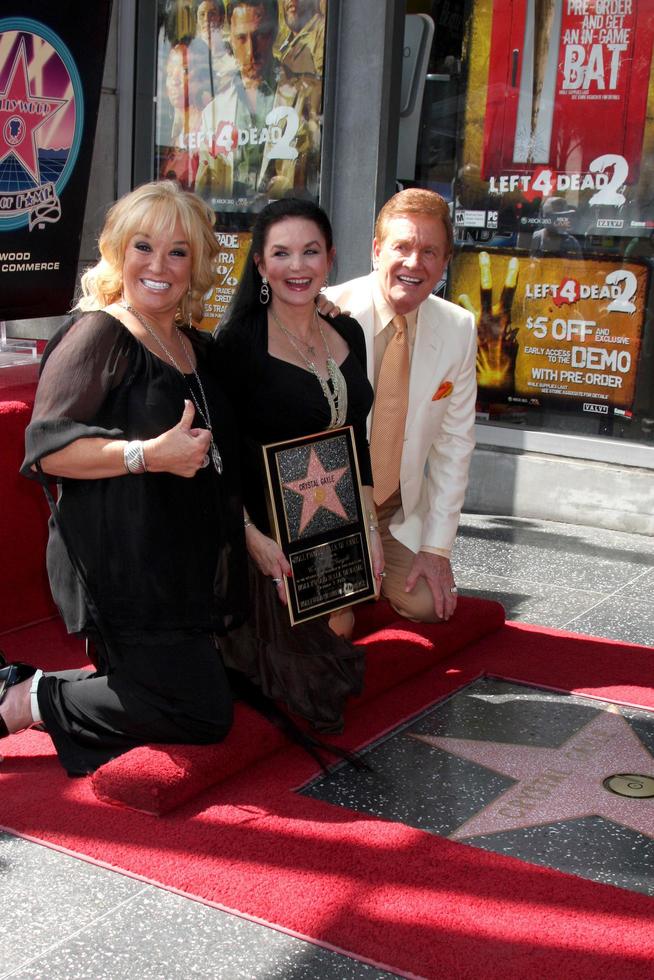 Tanya Tucker, Crystal Gale, Wink Martindale at the Hollywood Walk of Fame Star Ceremony for Crystal Gayle On Vine, Just North of Sunset Blvd Los Angeles, CA October 2, 2009 photo