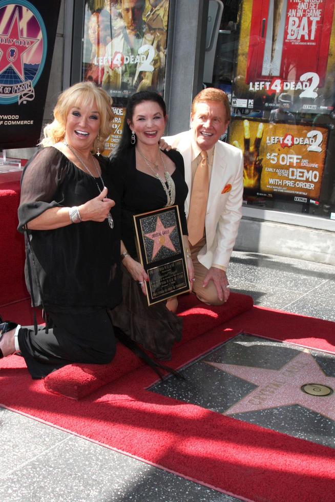 Tanya Tucker, Crystal Gale, Wink Martindale at the Hollywood Walk of Fame Star Ceremony for Crystal Gayle On Vine, Just North of Sunset Blvd Los Angeles, CA October 2, 2009 photo