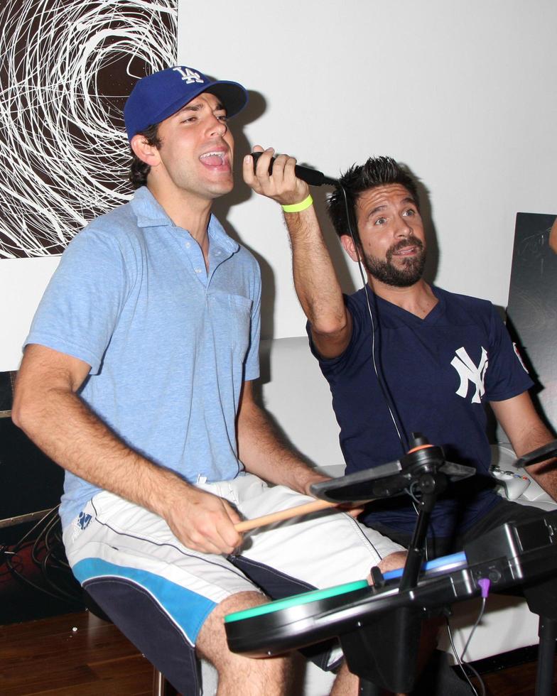 Zachary Levi and Joshua Gomez Chuck Kickoff party presented by Guitar Hero Five Roosevelt Hotel Pool Los Angeles, CA October 10, 2009 photo