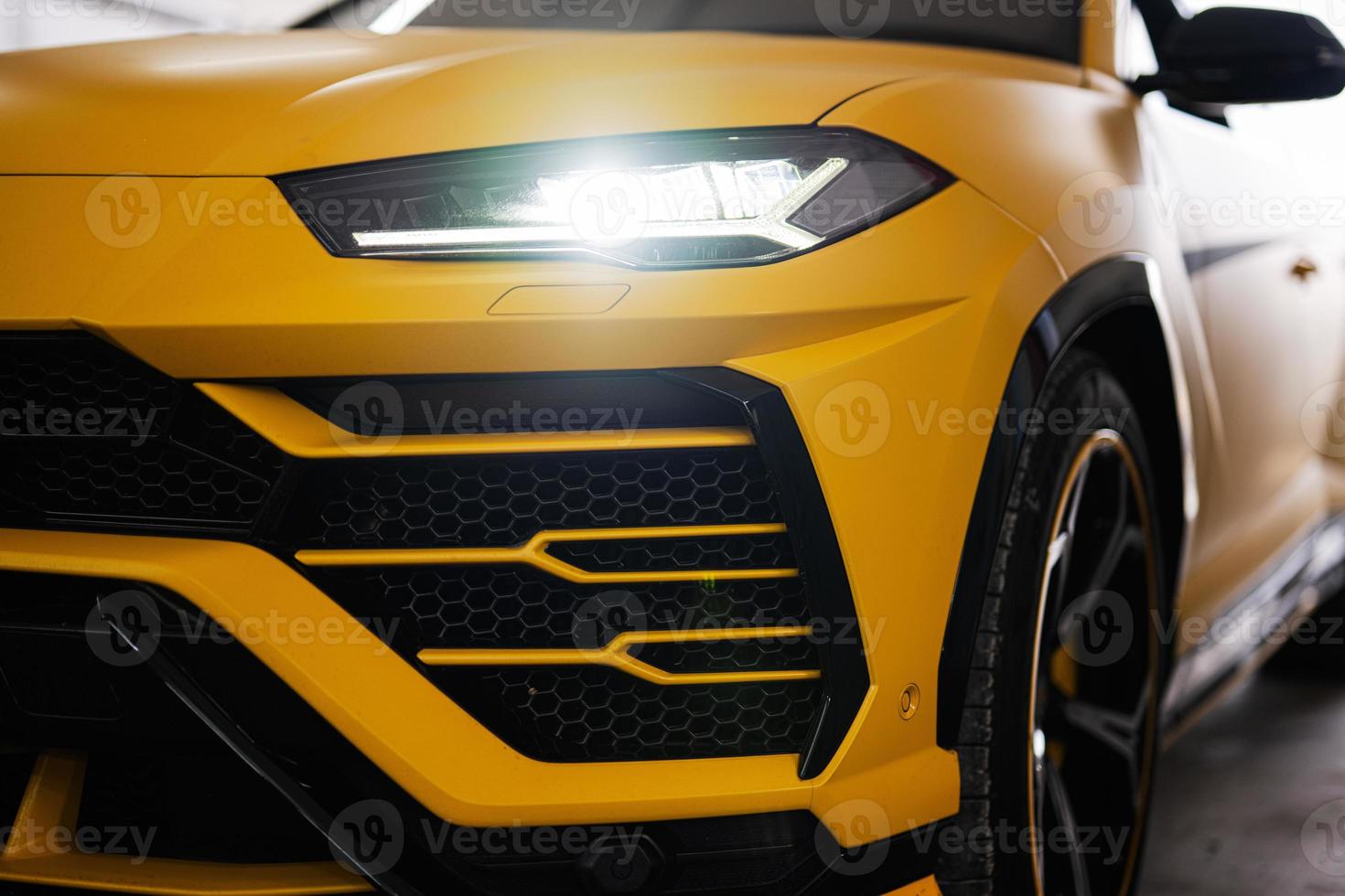 Headlights of yellow sport car suv. photo