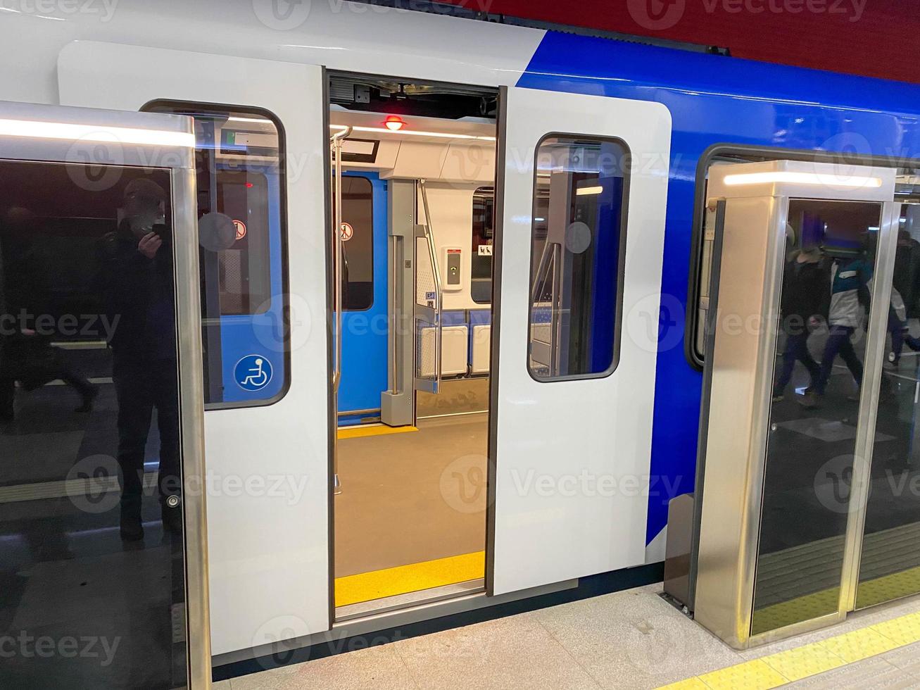 High speed train with opened automatic doors at the platform railway station photo