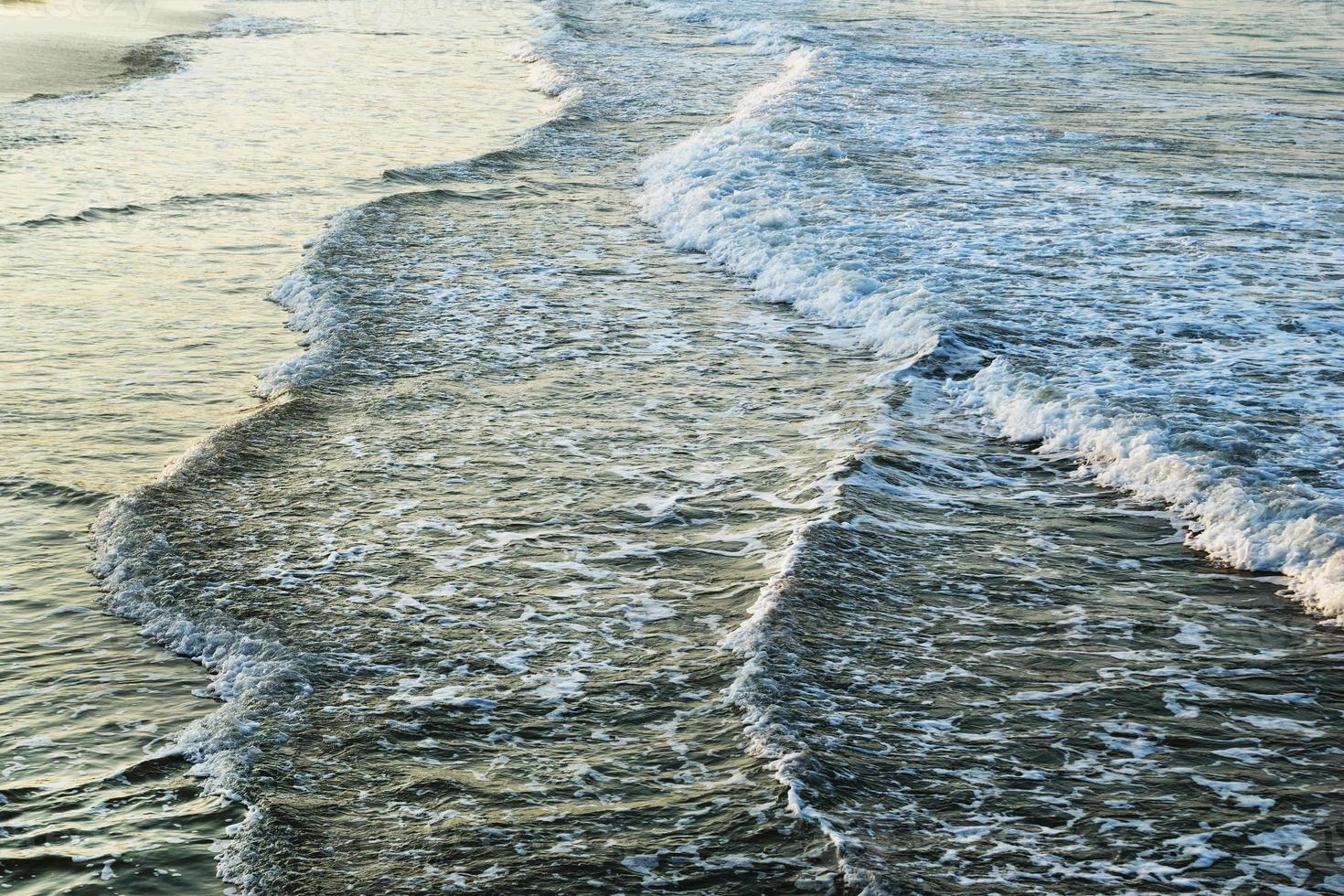 The view on the sea waves near to beach. photo