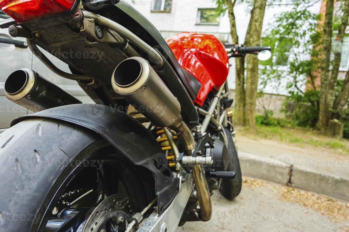 Beautiful powerful motorcycle rear view, Red Gas Tank, Motorcycle rear wheel, Exhaust Pipe, Stylish Motorcycle view photo