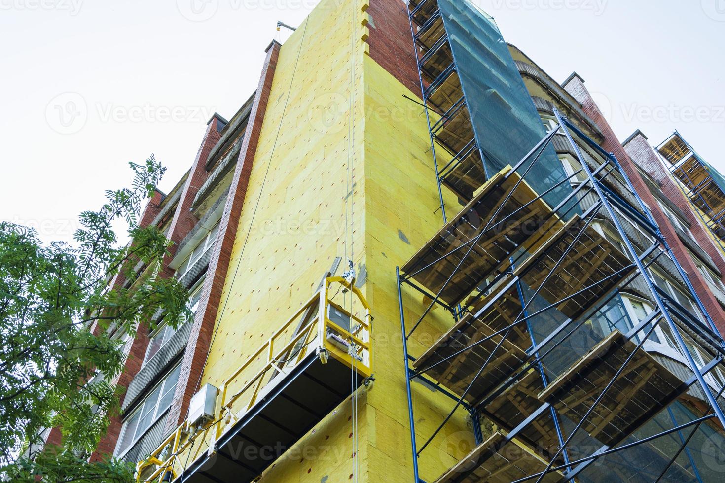 Insulation of the walls of a multi-storey building, Thermal insulation of the exterior walls of the house. photo
