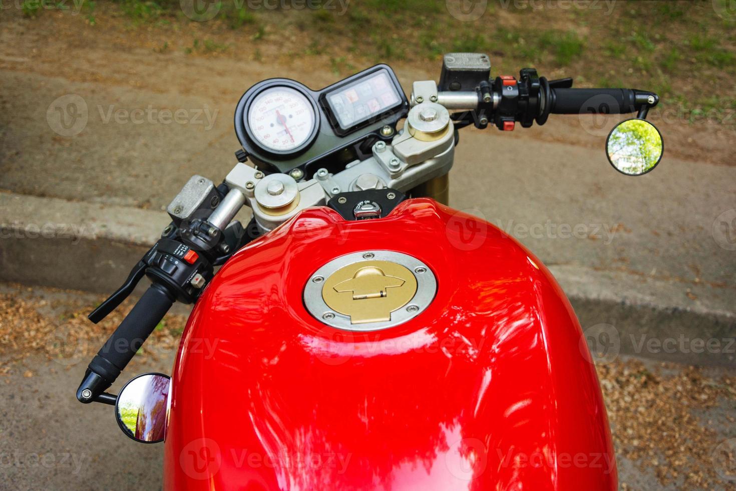 Beautiful powerful motorcycle top view, red motorcycle gas tank, steering wheel, speedometer, Stylish motorcycle view photo