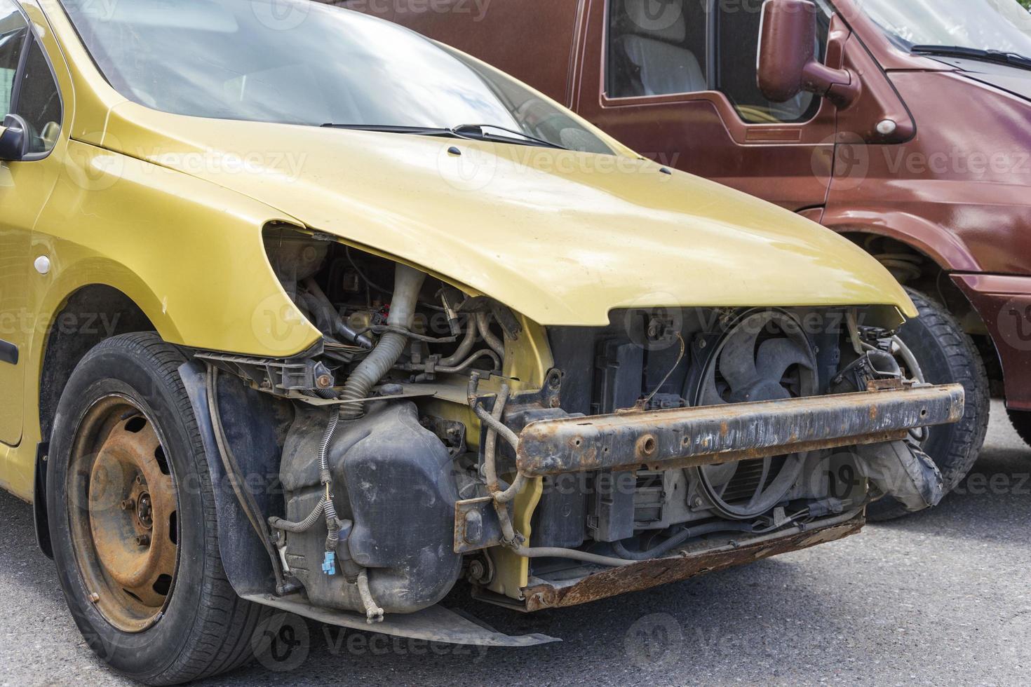 passenger car without headlights and bumper, car repair after a collision, repair after an accident photo
