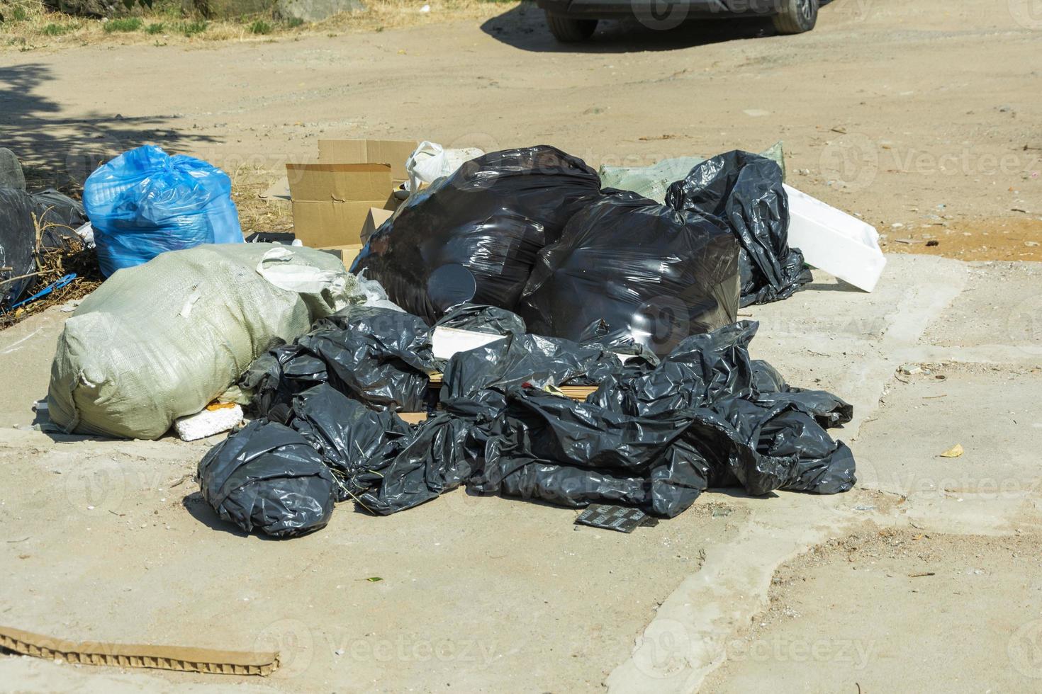 Plastic bags with garbage are lying on the site, construction debris in bags, ecology, environmental protection, photo