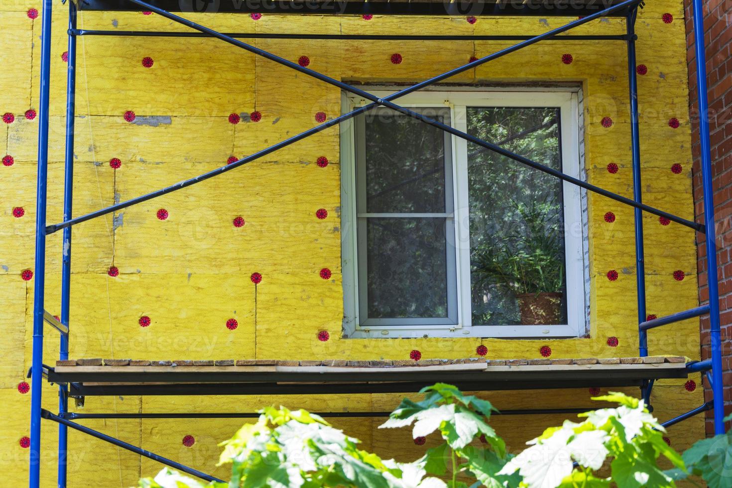 Insulation of the walls of a multi-storey building, Thermal insulation of the exterior walls of the house. photo