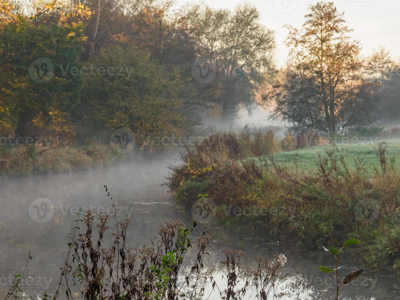 Autumn time at a river in germany photo