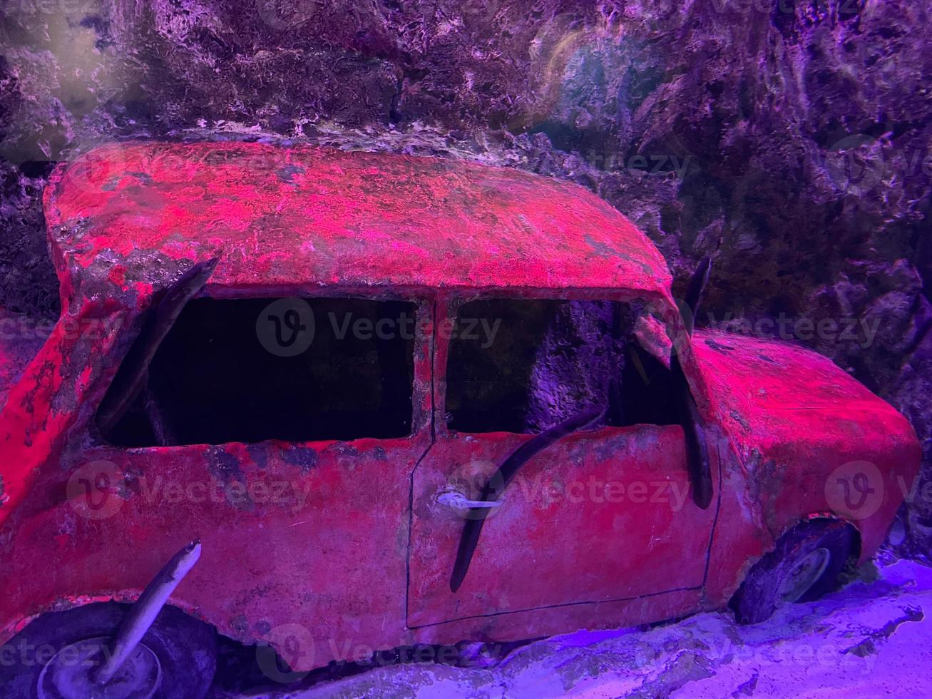 The remaining part of the motor van iCal at car wrecks scuba diving site under deep blue sea at the bottom of the ocean the south Of Thailand photo