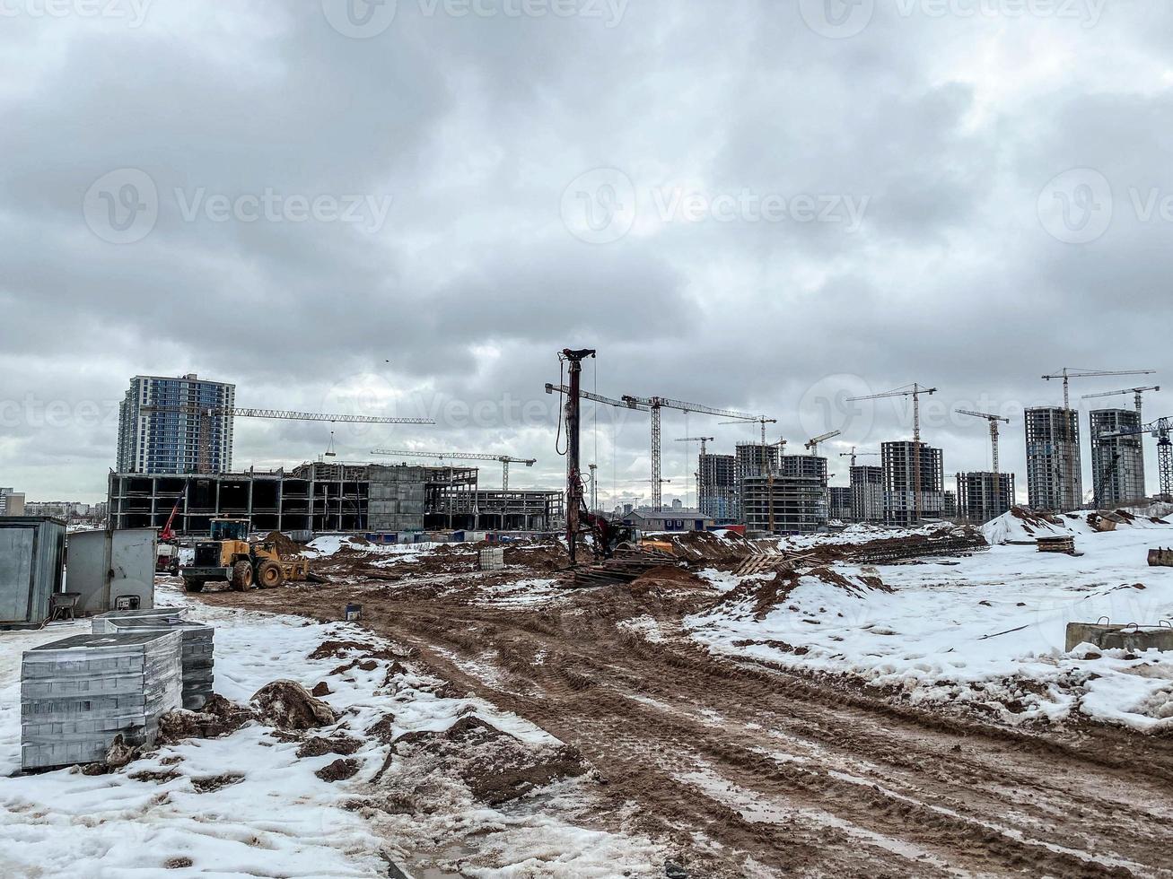 construction of houses, a shopping center from concrete blocks in the city. construction of a new residential area. construction of multi-storey buildings for people's lives photo