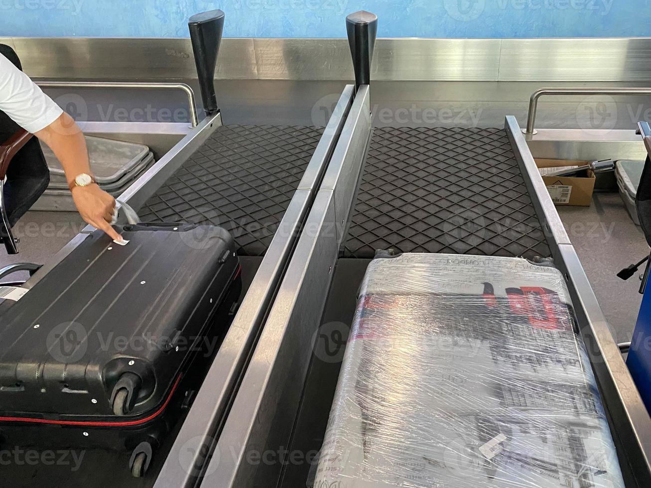 Luggage tape. A suitcase after check-in flight counter, desk rides in baggage compartment of airport. Passenger bag go to customs control, security check and to the airplane photo