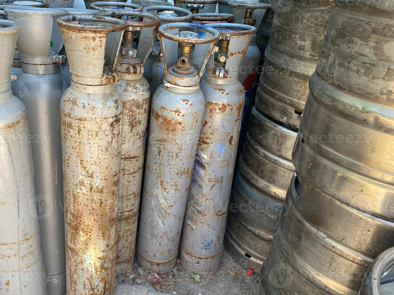 Technician inspecting gas canisters for welding in production line process. Quality Control Assurance concepts photo