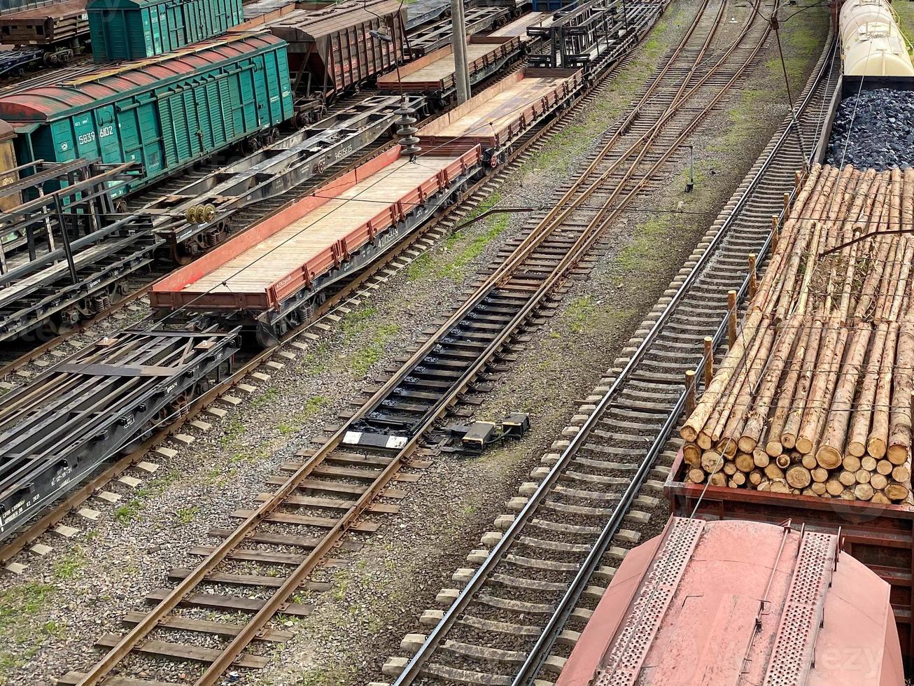 Railway wagons with cargo of metal and grain in port of Odessa. trains are waiting in line for loading at cargo terminal. most economical logistics solutions for rail transport photo