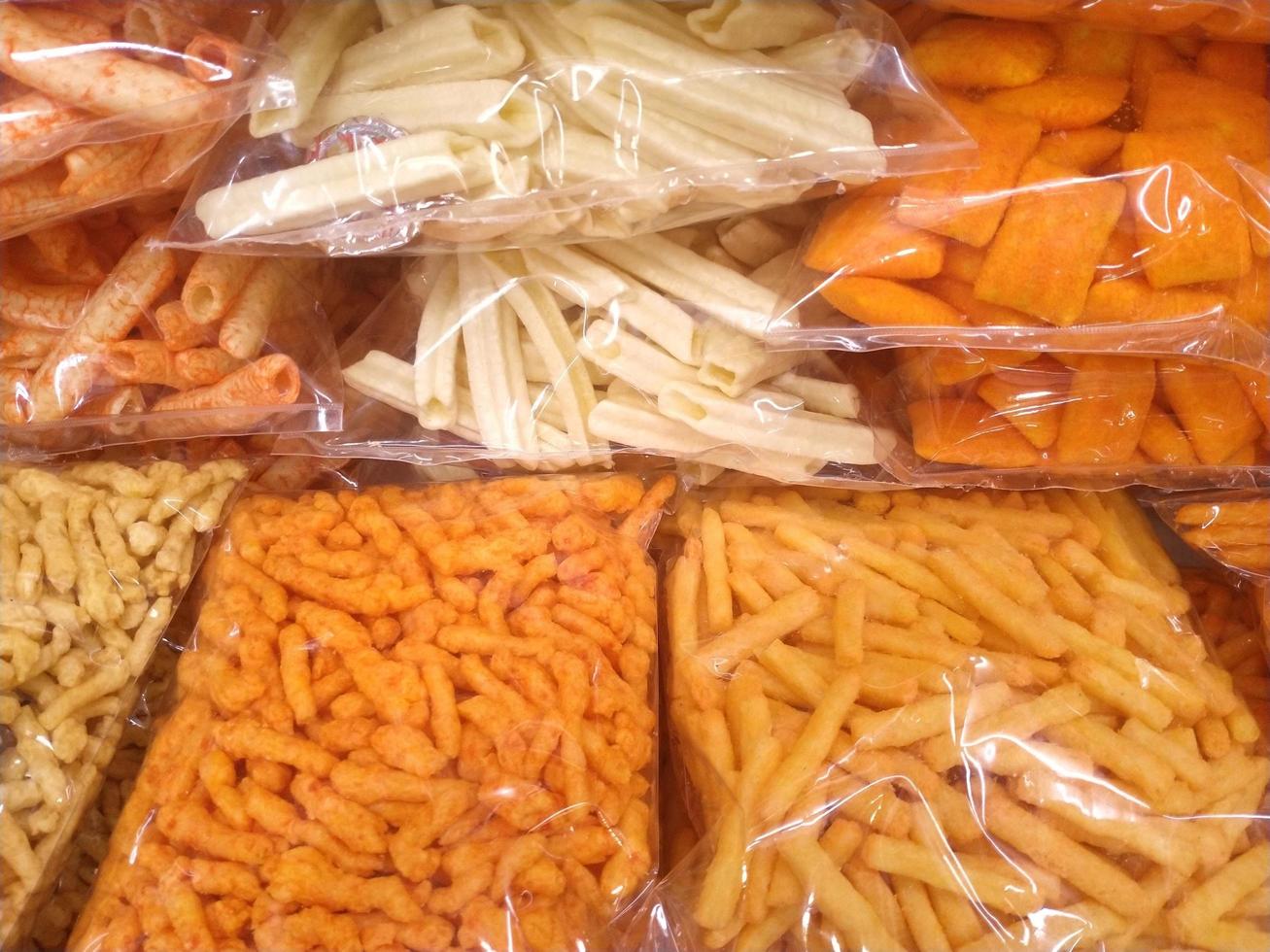 Salty and spicy snacks. Pretzels, chips, crackers photo