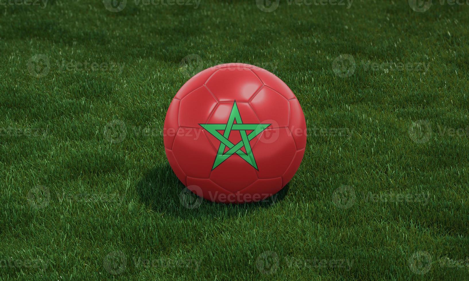 Soccer ball with Morocco flag colors at a stadium on green grasses background. photo