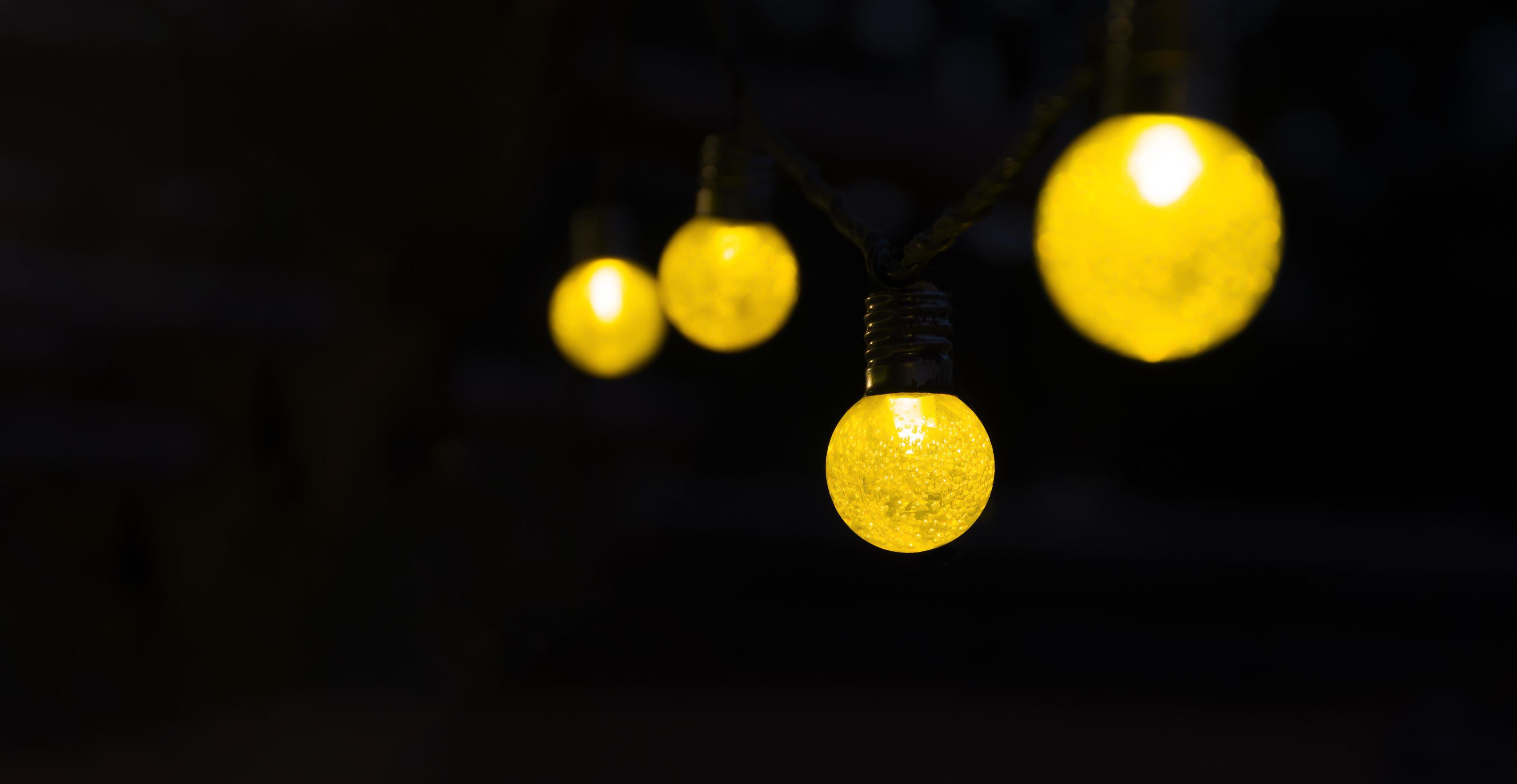 Yellow light bulb with black background with copy space 14737480 Stock