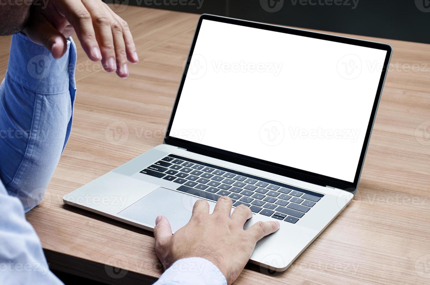 Businessman raise your hand with white screen background mock up on display laptop with clipping path photo
