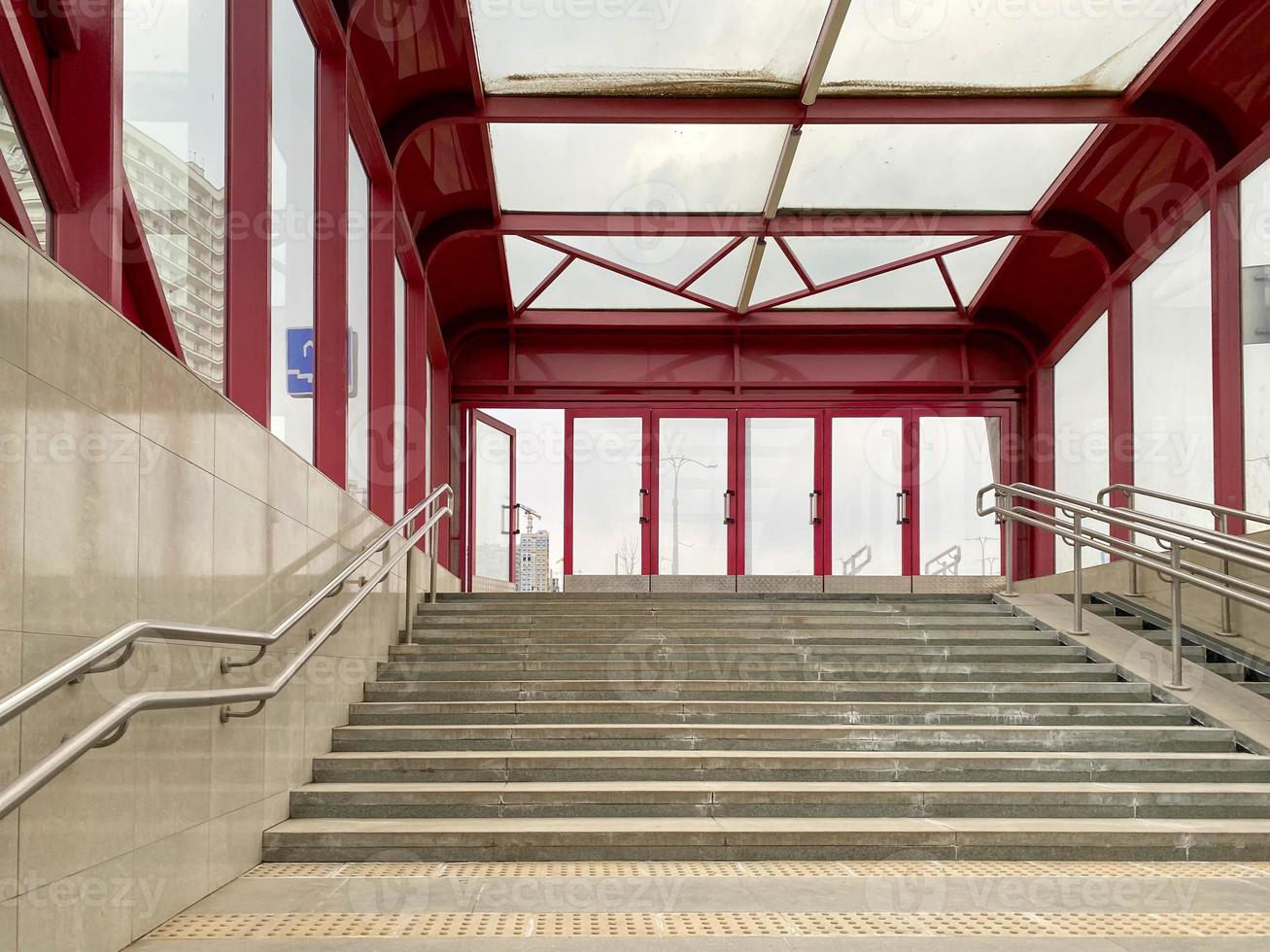 New modern underground passage across a large underground road with new renovation and granite tiles with stairs with steps. Urban infrastructure photo