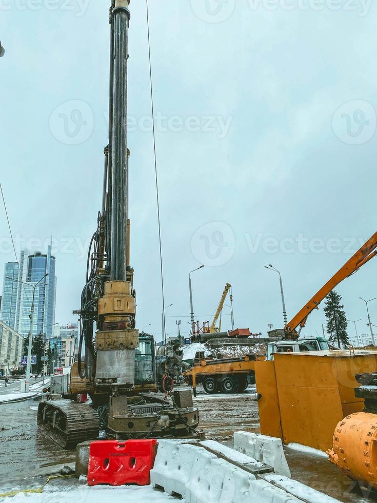 construction of a new bridge in the city center. the accumulation of workers and construction equipment at the construction site of the construction bridge. overpass construction photo