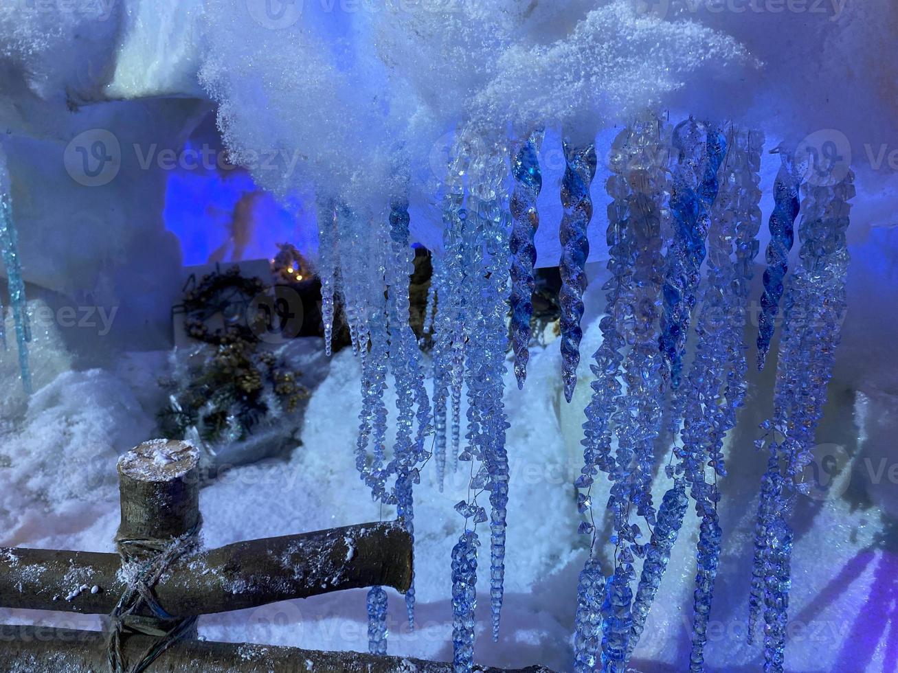 Illuminated Icicle Shaped Christmas Lights In Darkroom photo