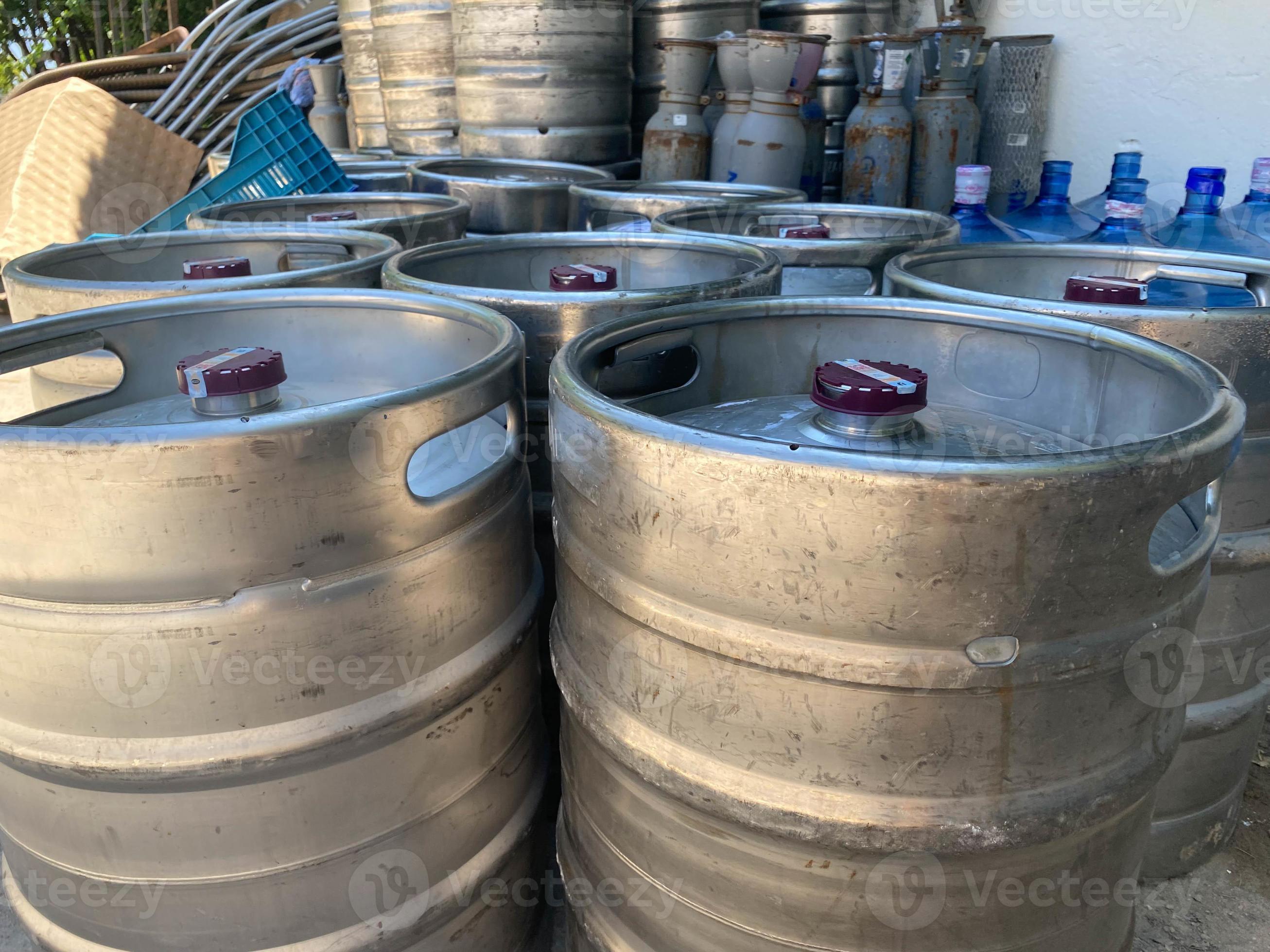 Stack of shiny stainless steel beer kegs outside of pub 14748577 Stock