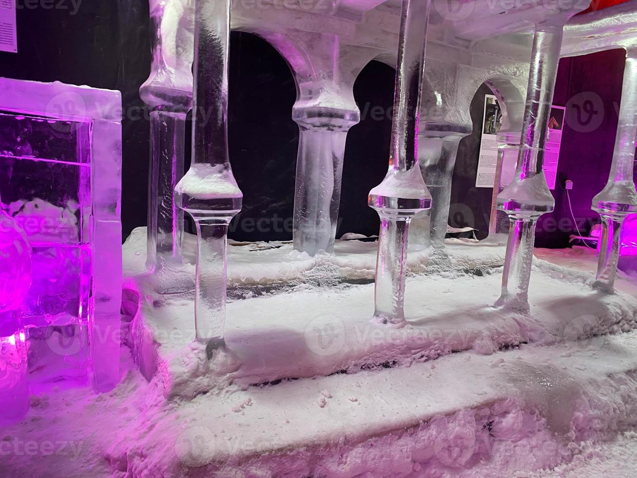 Large transparent winter ice sculptures and figures, columns at the festival. photo