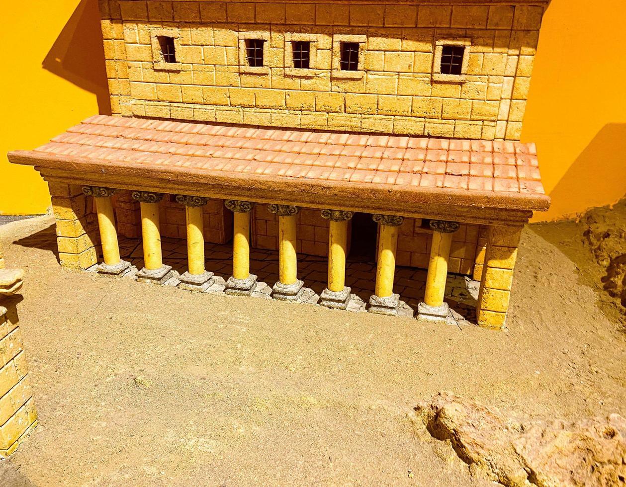 sandy brick house in a hot country. miniature of an antique, ancient building. small handmade excursion houses photo