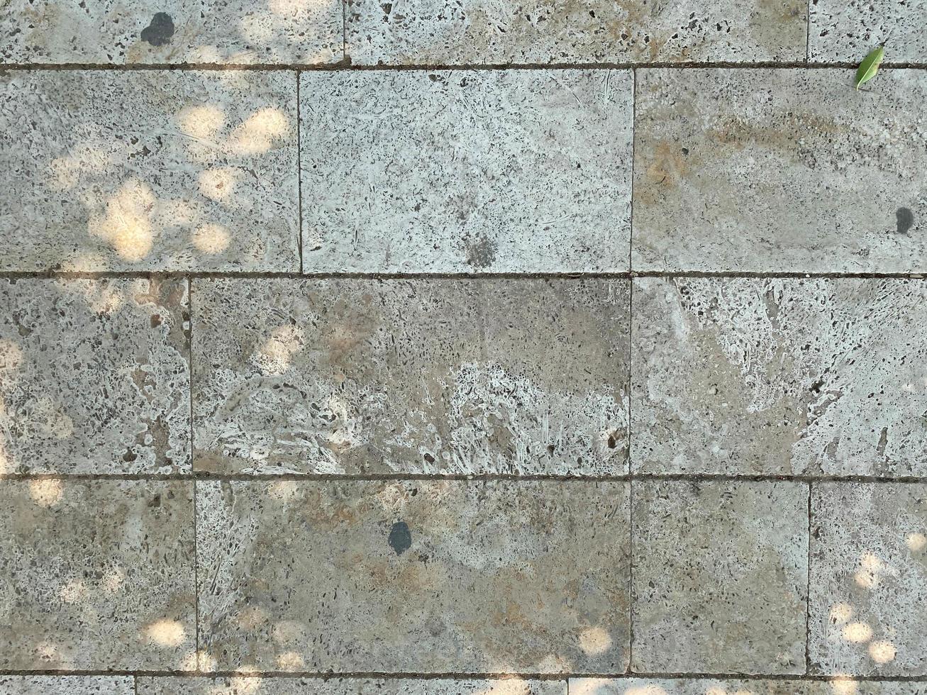 Gray marble rectangular tiles flooring pattern surface texture. Close-up of interior design decoration background photo
