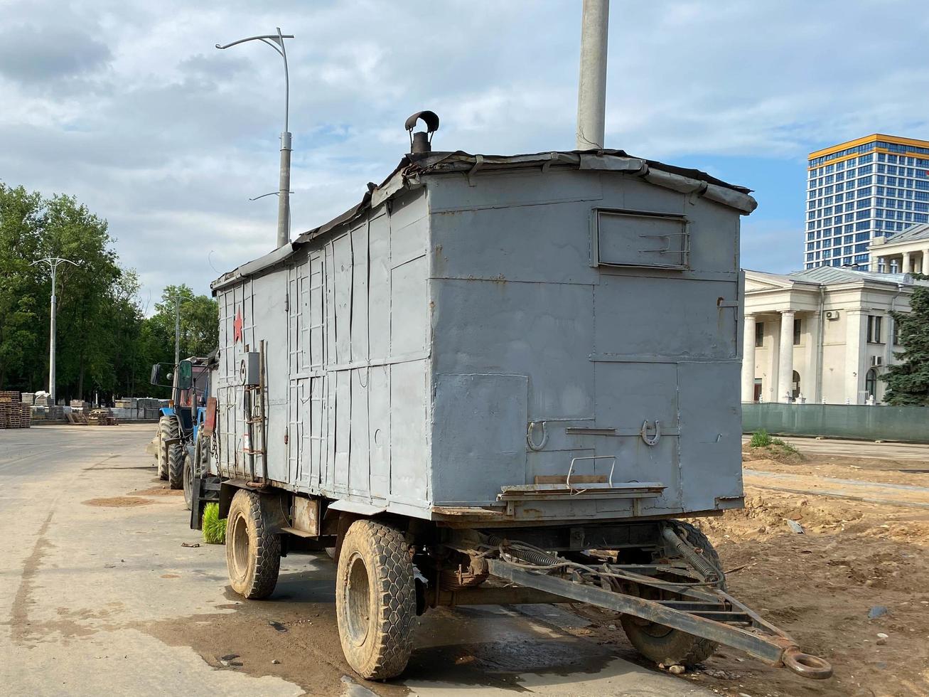 Large construction industrial mobile wagon, trailer for construction workers life at construction site photo