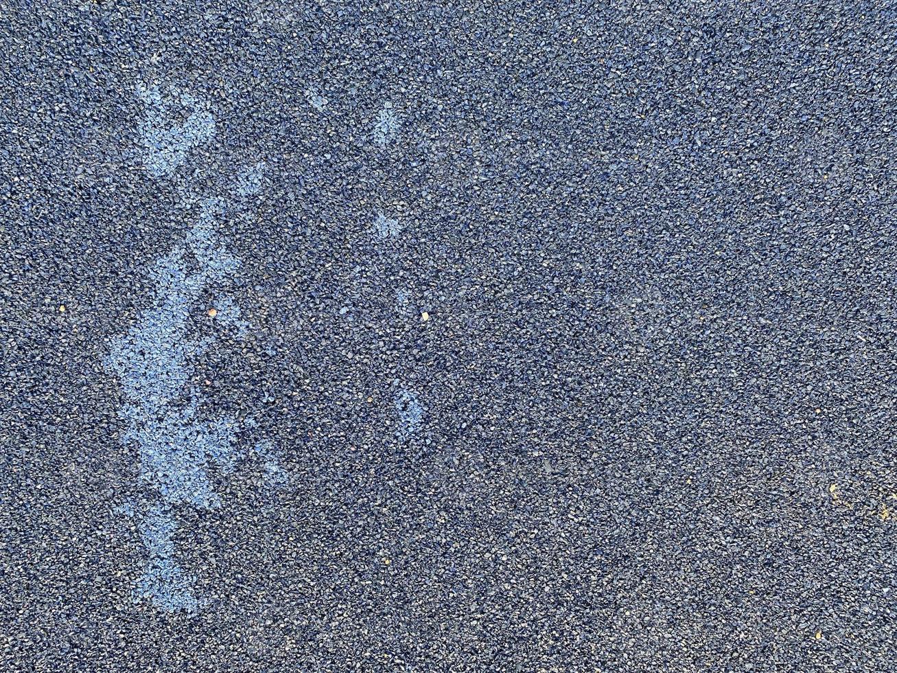 Blue rubber surface anti-traumatic safety tile on workout sports playground in public park or courtyard. The background. Texture photo