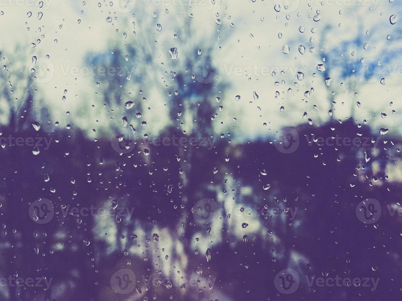 Beautiful surface texture of wet transparent glass in a window with clean cold drops after rain. The background photo