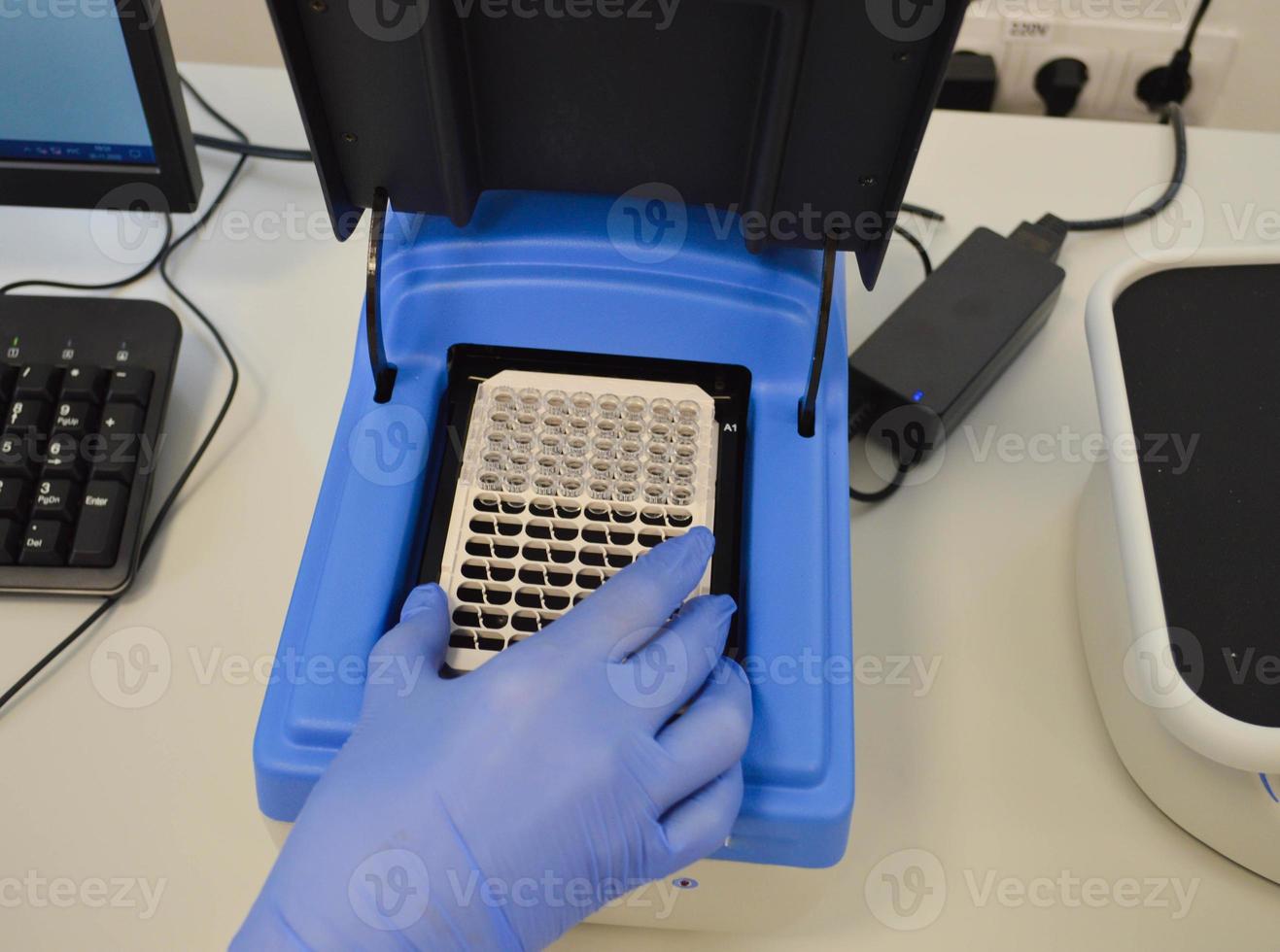 hand of a scientific taking a blood sample tube hand holding a tube test photo