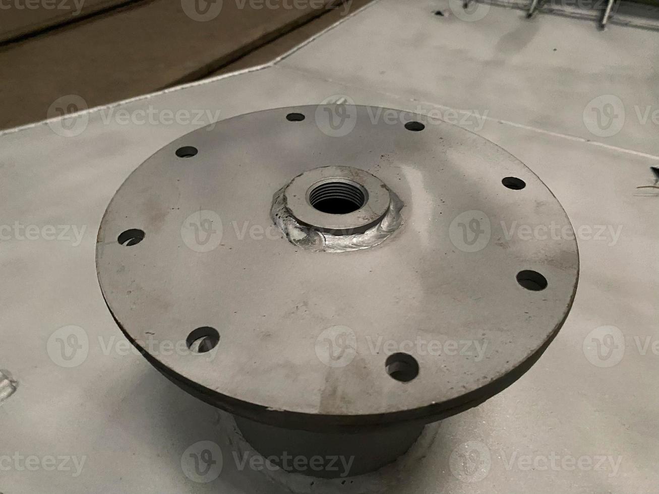 New flanges in the workshop of the plant photo